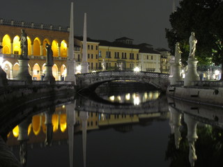 Padova, Italy - October 12th, 2019: Prato della Valle, in Padova, at night. The biggest square in Italy and one of the biggest in Europe, surrounded by a canal of water and by two rings of statues.