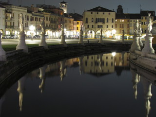 Padova, Italy - October 12th, 2019: Prato della Valle, in Padova, at night. The biggest square in Italy and one of the biggest in Europe, surrounded by a canal of water and by two rings of statues.