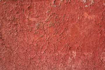 Cracked red paint with rust. Seamless old texture background