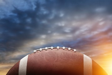 American football ball on sky background © BillionPhotos.com