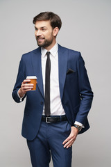 Young caucasian Businessman holding takeout paper cup coffee