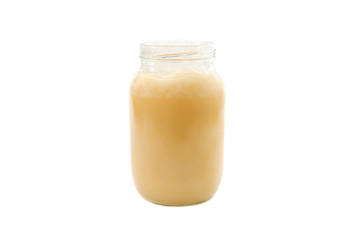 jar with honey isolated on a white background. Front view.