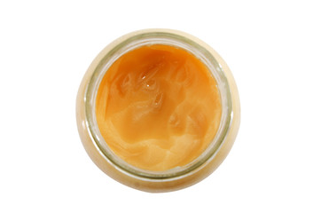 honey in a jar isolated on a white background.   Top view. Close-up.
