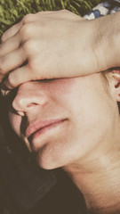 Naklejka premium Woman put her palm on her forehead during a headache