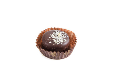 tasty, chocolate candy in a candy wrapper on a white background.