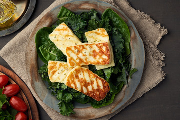 Cyprus fried halloumi cheese with healthy green salad. Lchf, pegan, fodmap, paleo, scd, keto diet.