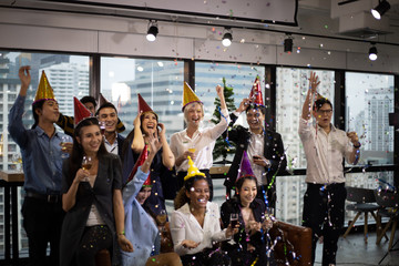 Business persons group happy new year party in the offices.	