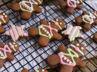 gingerbread men on a wire rack. christmas cookies on bdsm theme. gingerbread cookies for adults