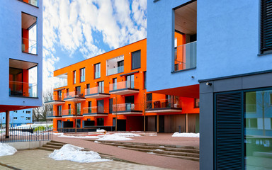 Blue red Modern residential flat apartment building exterior Salzburg reflex