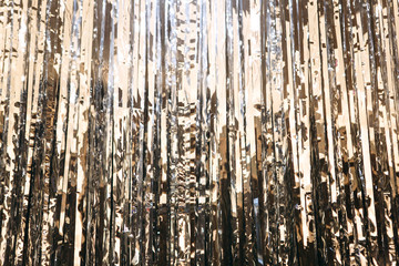 Obraz premium Glowing silver cut ribbon foil abstract background