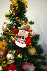 Selective focus vintage toys hanging on Christmas tree. New year 2020.