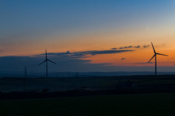 Fototapeta na wymiar wind turbines at sunset