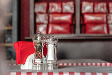 Set for spices on a table in a cafe