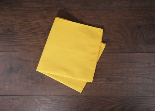 The Yellow Tablecloth On Wood Background 