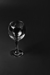 Empty wine glass on black background