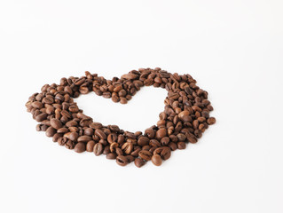Coffee beans arranged as heart shape