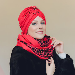 Photo of self assured Arabian lady in hijab, shows you right way, points at blank space with both...
