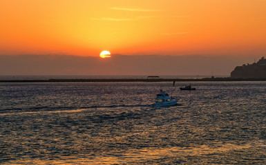 Fototapeta premium Fishing Boats Returning at Sunset
