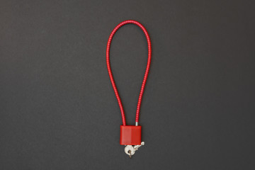 Firearm cable lock isolated on black background. 