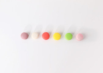 Obraz premium Colored macarons on white background