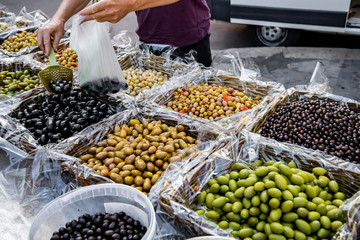 Marinated stuffed olives sold in the market.