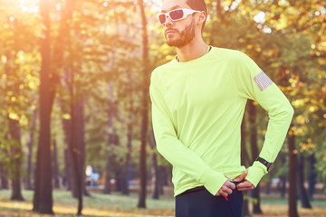 Man preparing for jogging / exercising in the park.