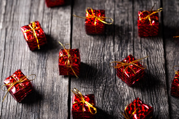 New Year red gift boxes layout on wooden background.
