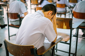 School students Asian are having headaches with midterm exams , Final exams 