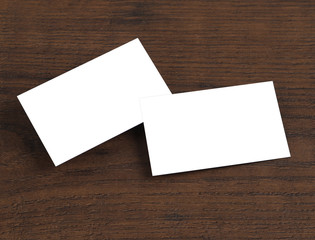 Mock up of business cards on wood background.