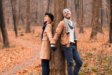 Couple in the park enjoying nice autumn / winter time.