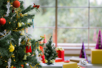 Celebrate season concept, Merry Christmas and happy new year, Beautiful decoration Christmas tree by the window.