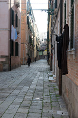 Narrow street with colorful houses in the city of Venice	