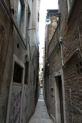 Narrow street with colorful houses in the city of Venice