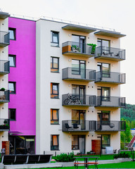 Fototapeta premium Modern residential home and house apartment building exterior children playground reflex