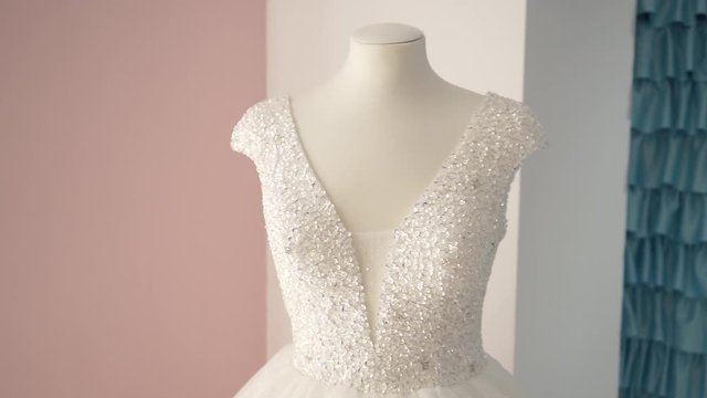 wedding dress with neckline on a mannequin
