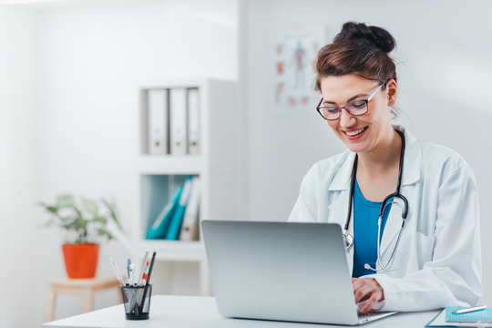 Portrait Of Young Woman Doctor On The Job