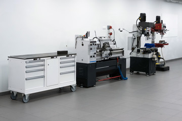 Professional car fixing instruments. Modern vehicle construction work tools. Automobile repair instruments inside the workshop next to the wall