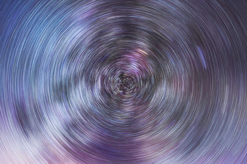 Beautiful starry sky with star trails orientation on the north star. Space background. Abstract long exposure background.