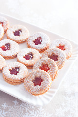 Traditional christmas linzer cookies on a white dish, selective focus