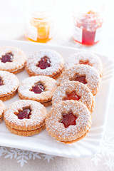 Traditional christmas linzer cookies on a white dish, selective focus