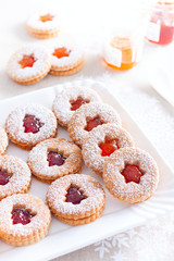 Traditional christmas linzer cookies on a white dish, selective focus