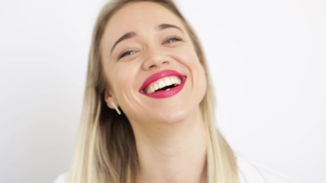 Happy laughing woman in white portrait. Video footage