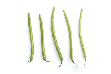 Bunch of green french beans isolated on white background. top view.