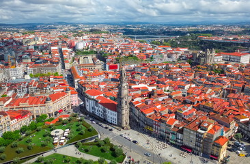 Fototapeta na wymiar Porto Portugal aerial top view on catholic church or cathedral Torre dos Clerigos, central square cityscape, red roofs