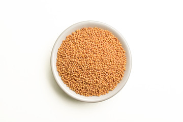 top view of mustard seeds in white bowl