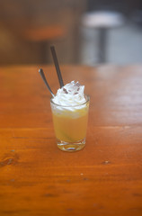 Christmas Bombardino cocktail with egg liqueur and rum. Italian cream hot drink. Italy, Europe.