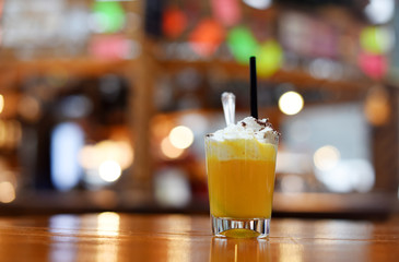 Christmas Bombardino cocktail with egg liqueur and rum. Italian cream hot drink. Italy, Europe.