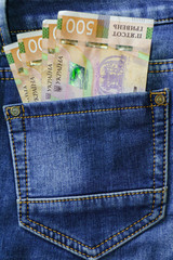 Ukrainian money. New banknotes five hundred hryvnia bills UAH in the back pocket of blue jeans. Money concept, Corruption.