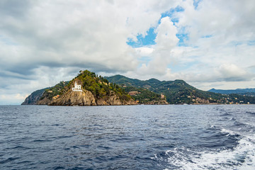 View on Portofino lighthouse from the sea, Liguria - Italy