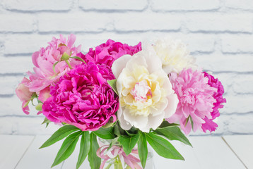 Beautiful bouquet of pink and white peonies. Holiday card with a bouquet of summer flowers. Summer flowers peonies.